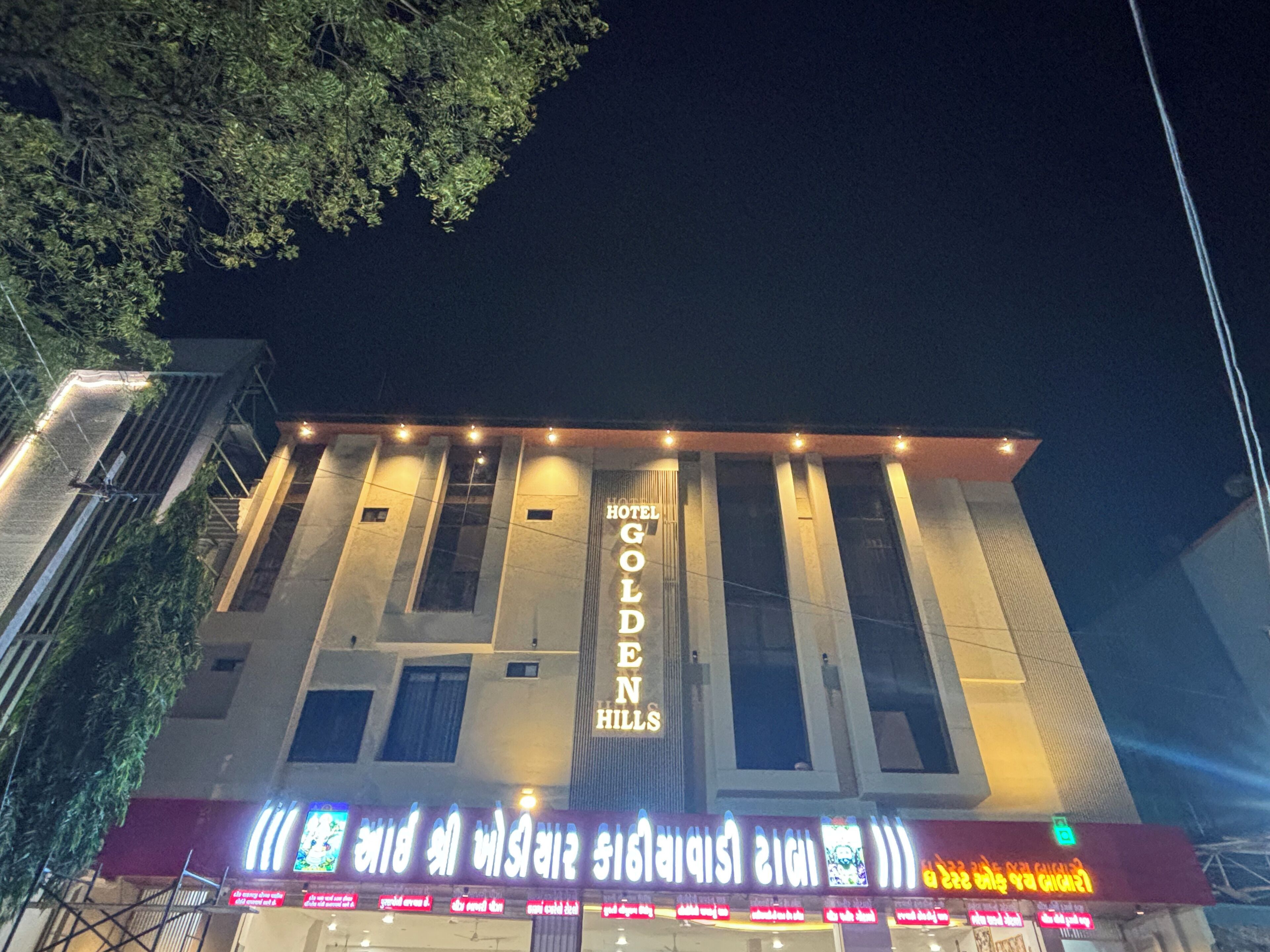A hotel with a prominent sign reading "Golden Hills."