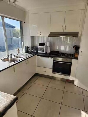 Fridge, microwave, oven, stovetop - Canal condo in Mooloolaba (Sunshine Coast)