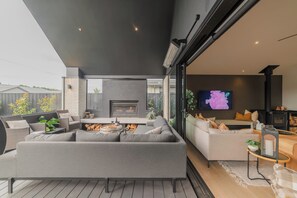 TV, fireplace - Stylish Home w- Private Spa, Indoor & Outdoor Fire (Prebbleton)