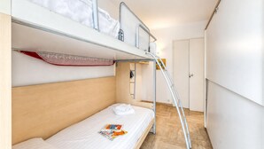 A bunk bed room with a ladder, a door, and a magazine on the lower bunk. - Cannes Sea View - Port du Moure Rouge, Cannes, France (Cannes)