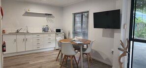 Fridge, electric kettle, toaster, dining tables