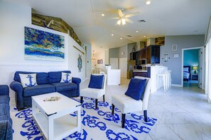 A living room with a sofa, chairs, a coffee table, and a rug with a blue pattern. - Mar-Key Paradise | 100' Dockage, Atlantic Access & 3 En-Suite Bedrooms (Marathon)