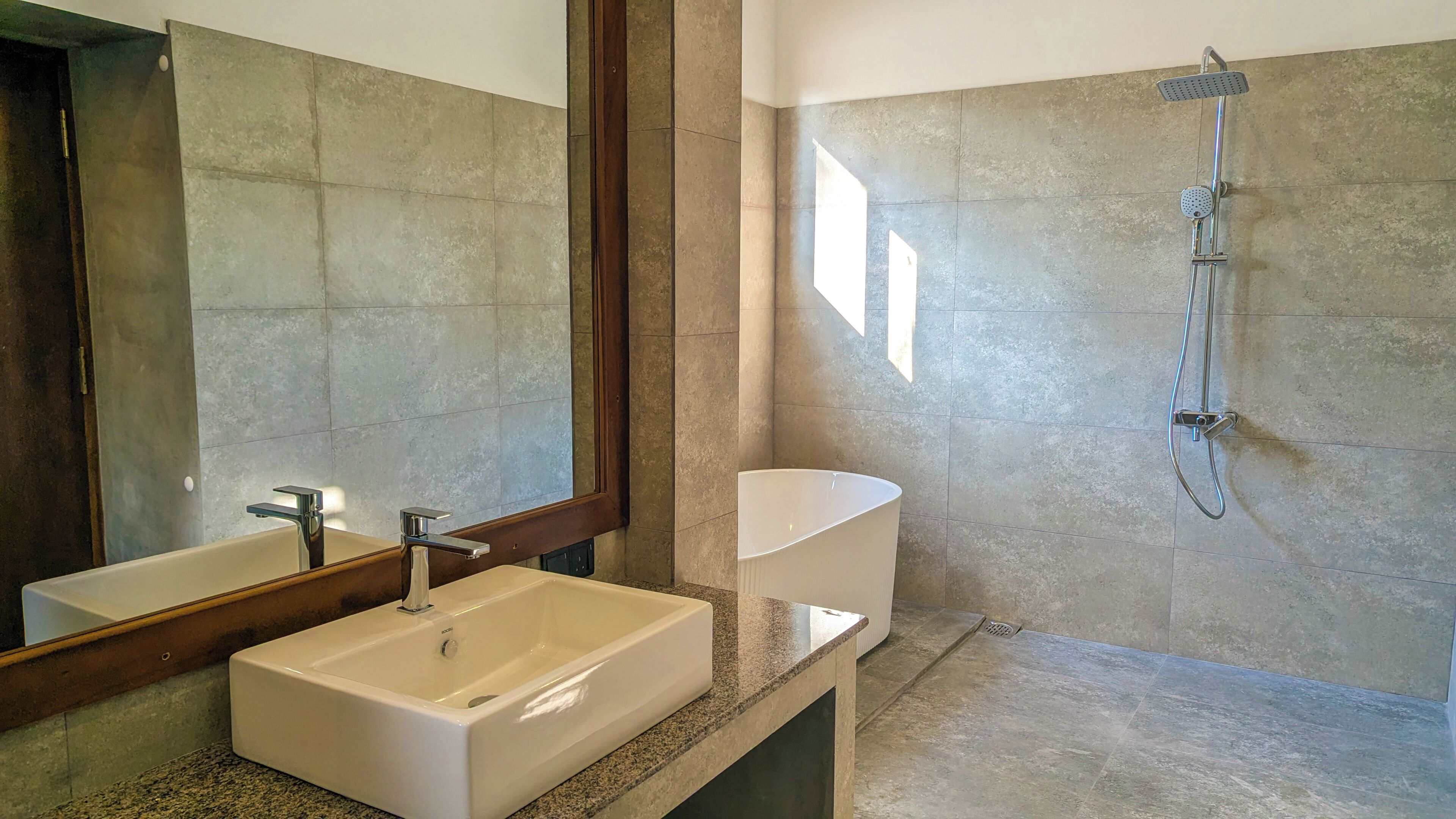 Separate bathtub and shower, hair dryer, slippers, towels