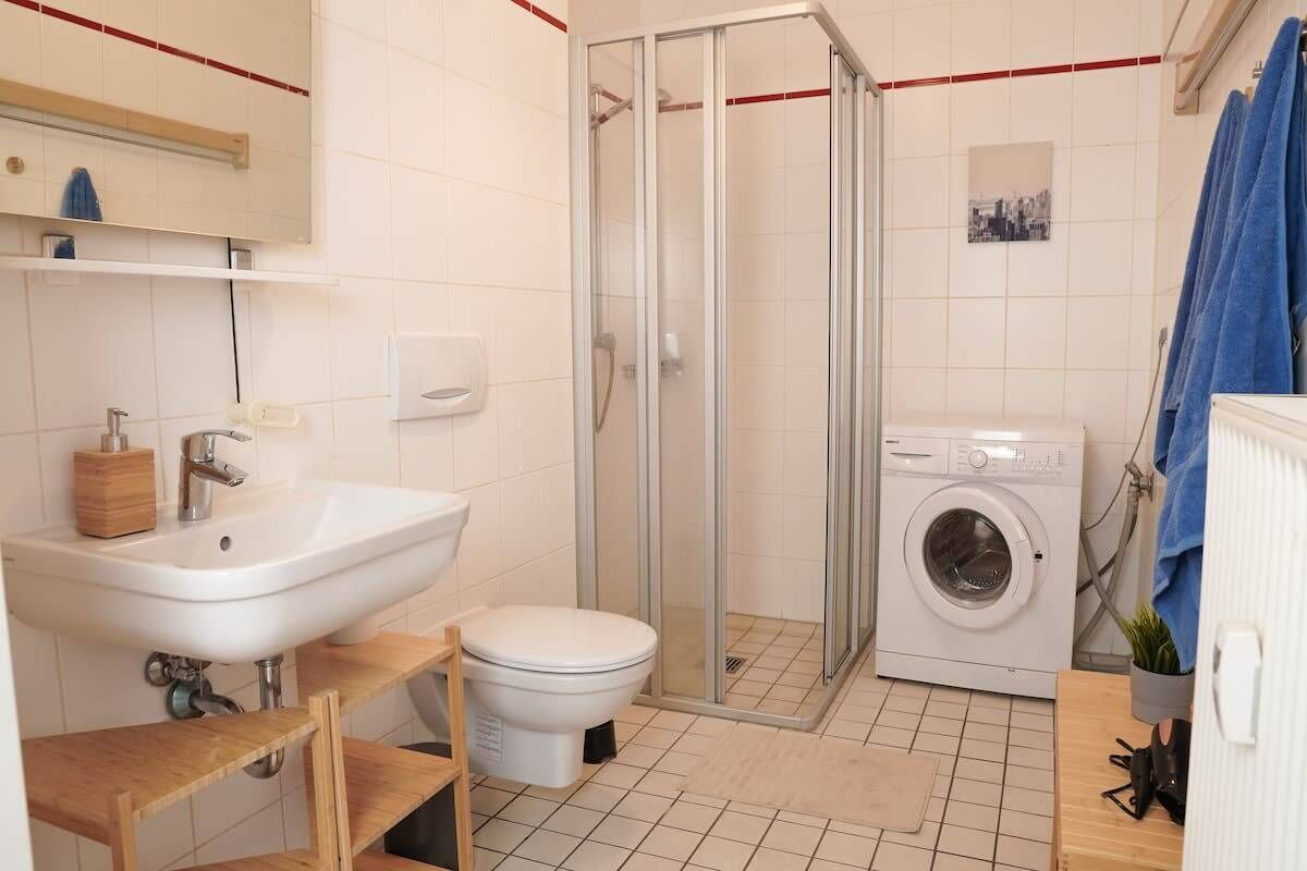 Shower, hair dryer, towels, toilet paper