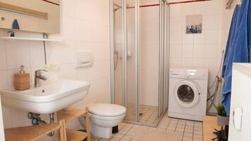 Shower, hair dryer, towels, toilet paper