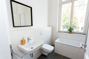 Shower, hair dryer, towels, toilet paper