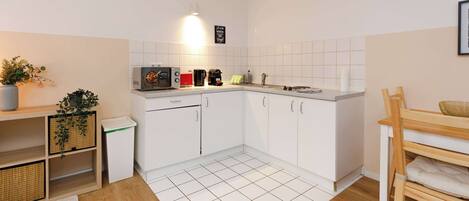 Fridge, stovetop, toaster, cookware/dishes/utensils