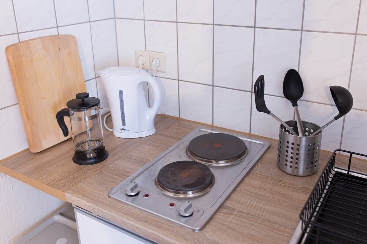 Fridge, stovetop, coffee/tea maker, cookware/dishes/utensils