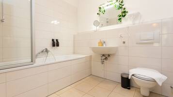 Shower, hair dryer, towels, toilet paper