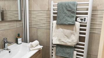 Hair dryer, towels, soap, shampoo