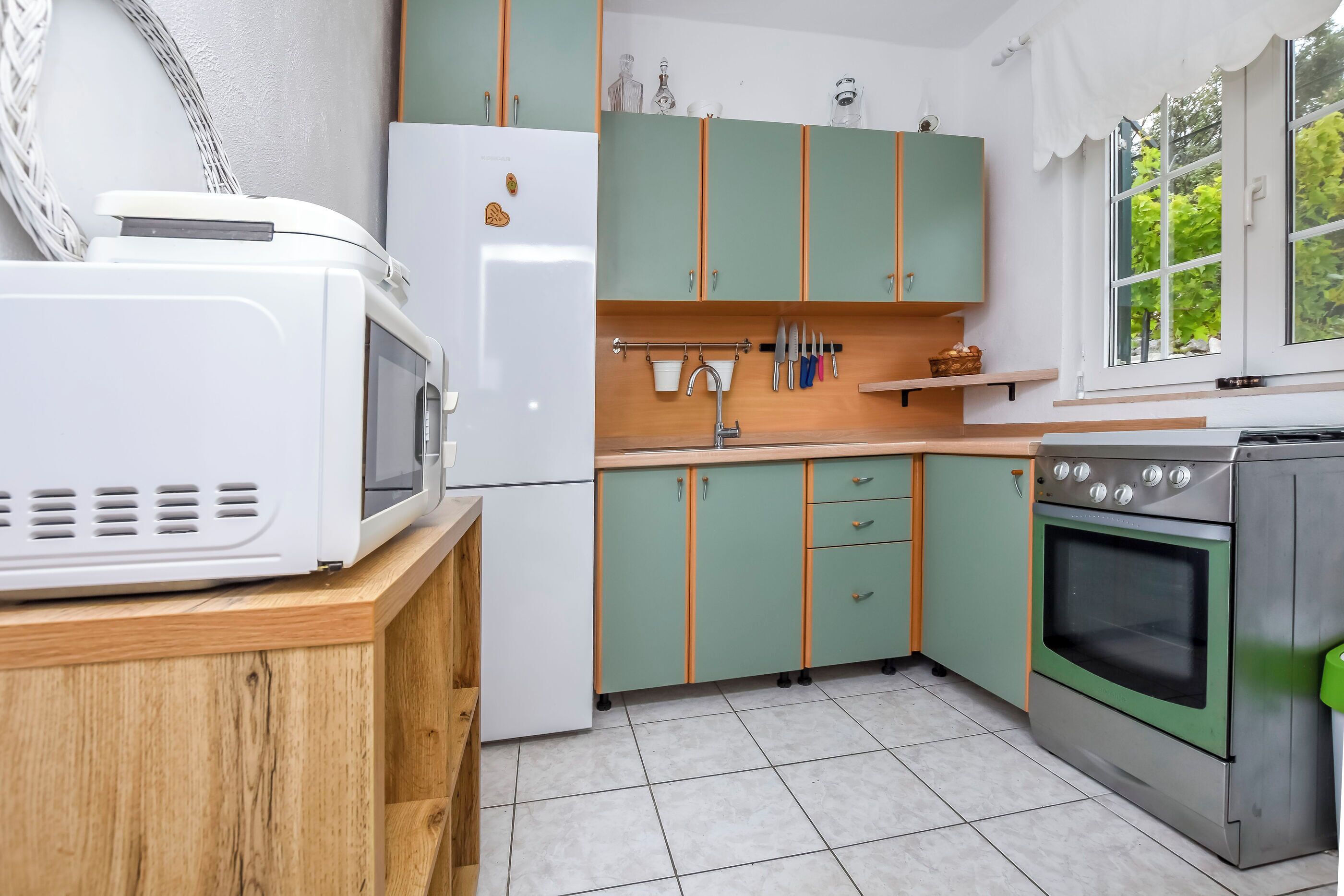 Appartamento (A5) | Cucina privata | Frigorifero, microonde, piano cottura, bollitore elettrico