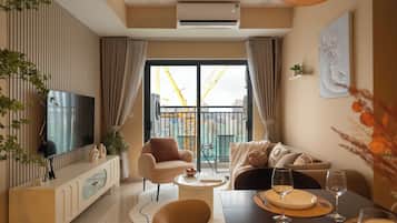 Luxury Apartment | Living area | Flat-screen TV