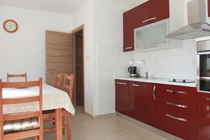 Apartment (A1) | Private kitchen | Fridge, microwave, oven, stovetop - Apartment Vinko (Postira)