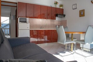 Apartment (A2) | Private kitchen | Fridge, microwave, stovetop, espresso maker - Apartments Daira (Solta)