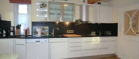 Fridge, oven, stovetop, dining tables