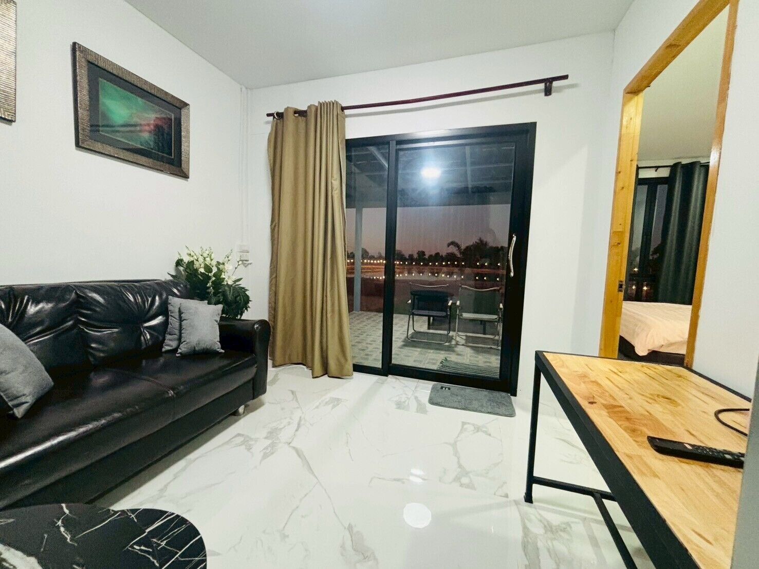 Deluxe Villa | Living area | 32-inch TV with cable channels