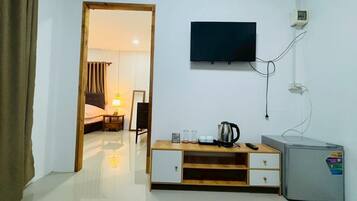 Villa | Living area | 32-inch TV with cable channels