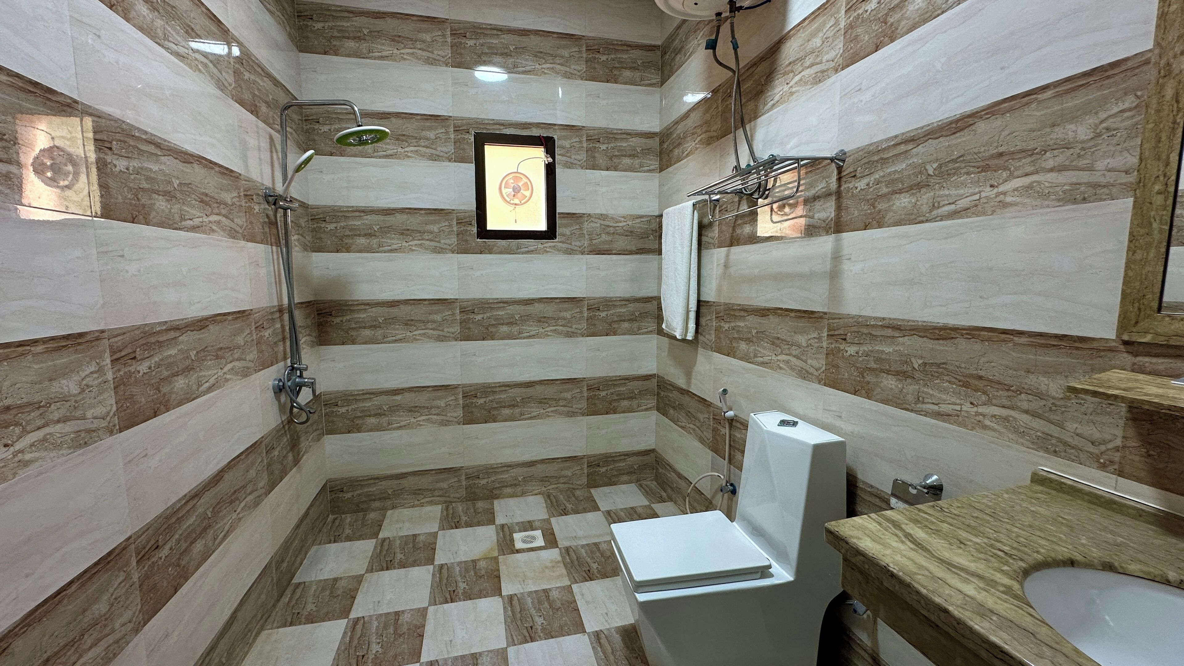 Separate tub and shower, towels, soap, shampoo