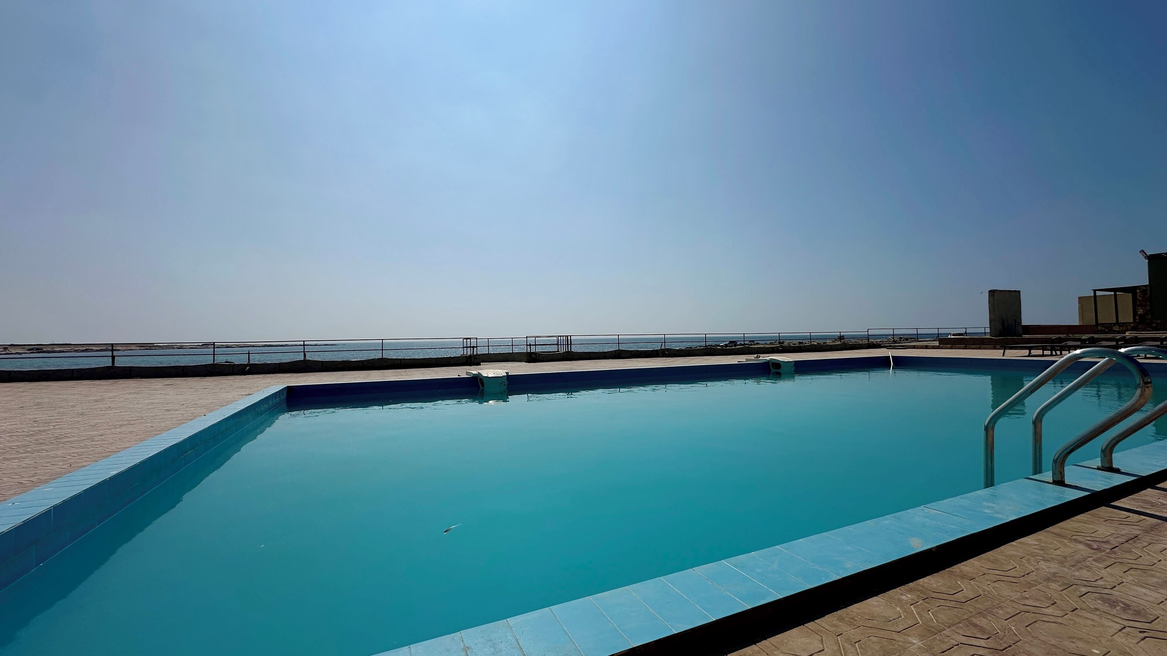 Outdoor pool, sun loungers, lifeguards on site