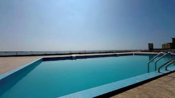 Outdoor pool, sun loungers, lifeguards on site