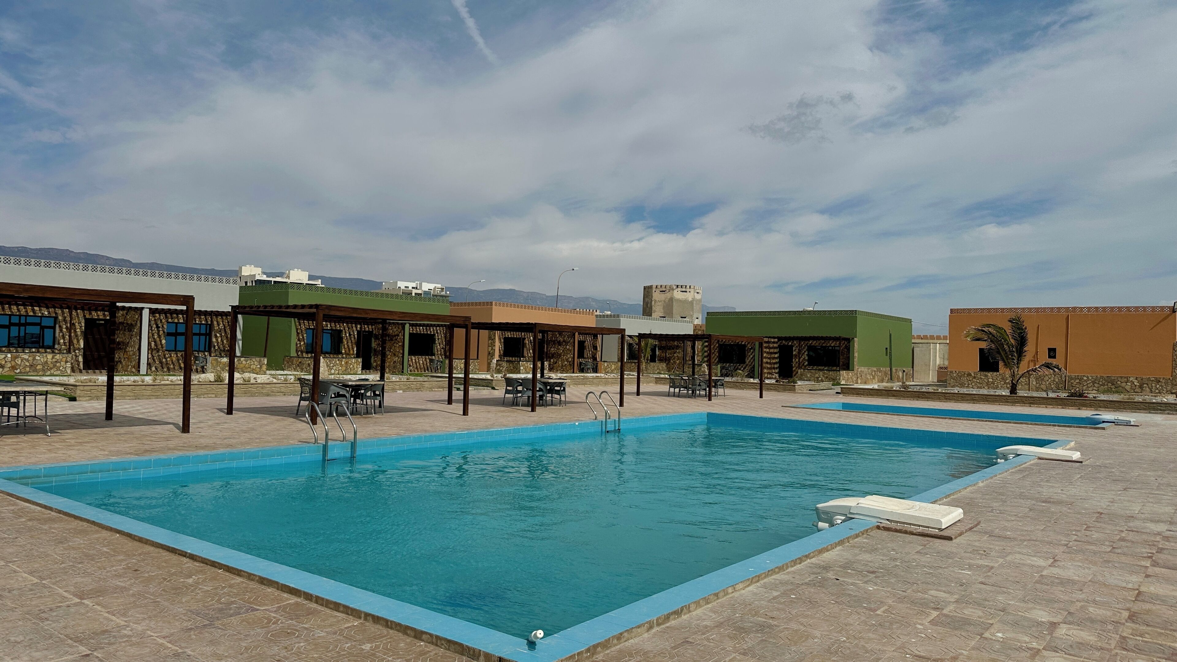 Outdoor pool, sun loungers, lifeguards on site