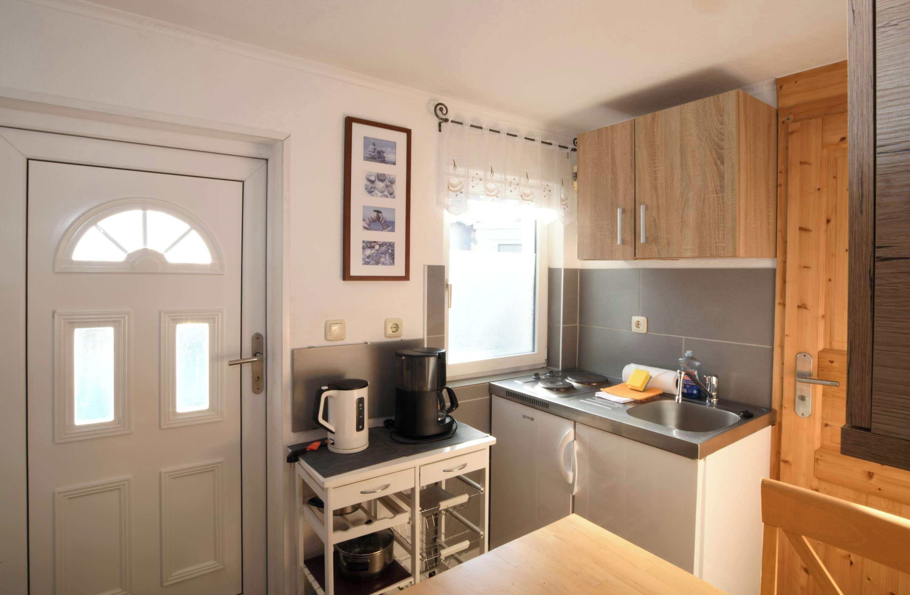 Fridge, coffee/tea maker, cookware/dishes/utensils