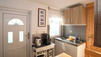 Fridge, coffee/tea maker, cookware/dishes/utensils