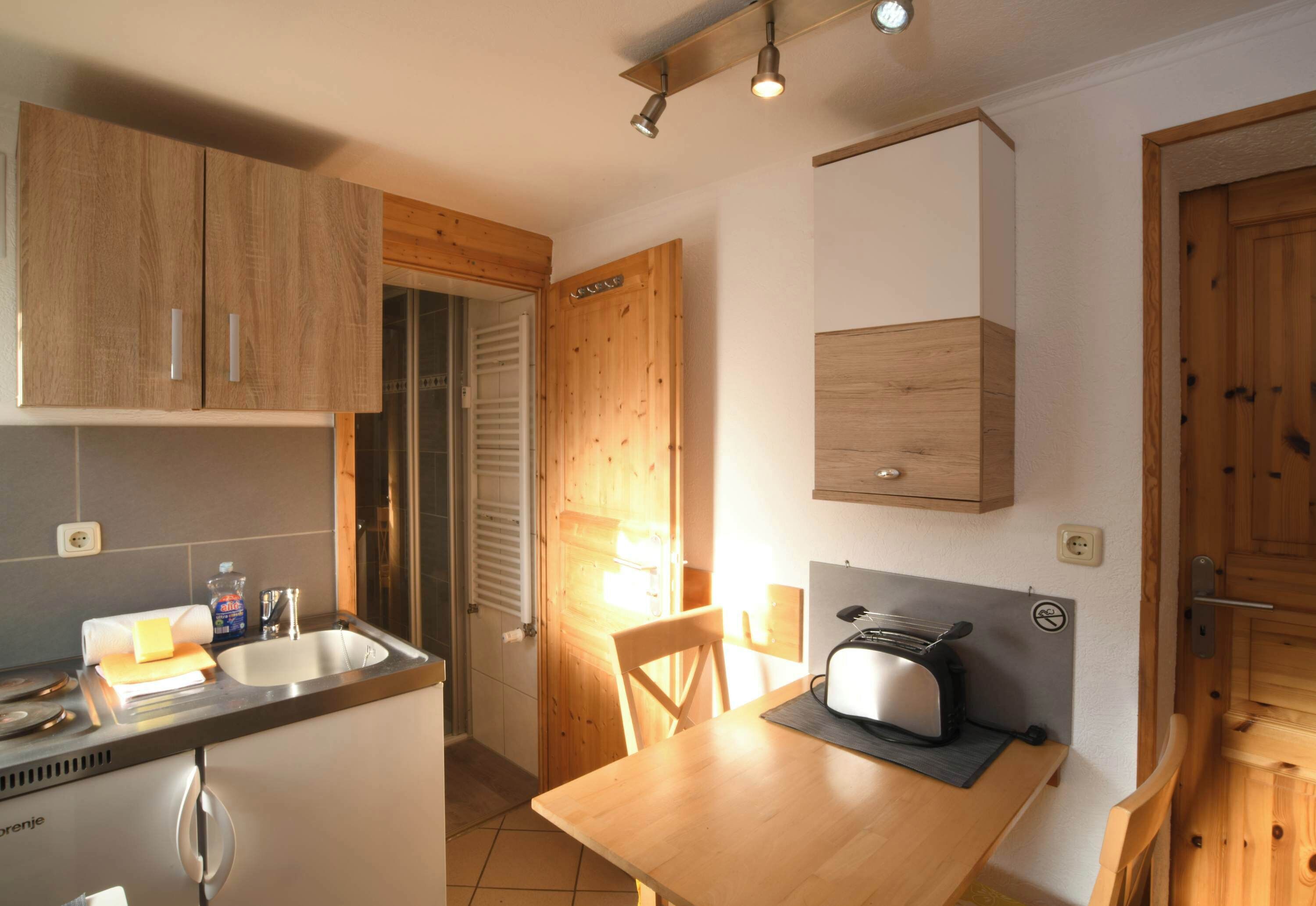 Fridge, coffee/tea maker, cookware/dishes/utensils