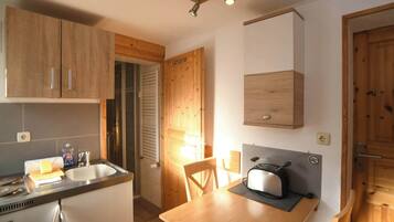 Fridge, coffee/tea maker, cookware/dishes/utensils