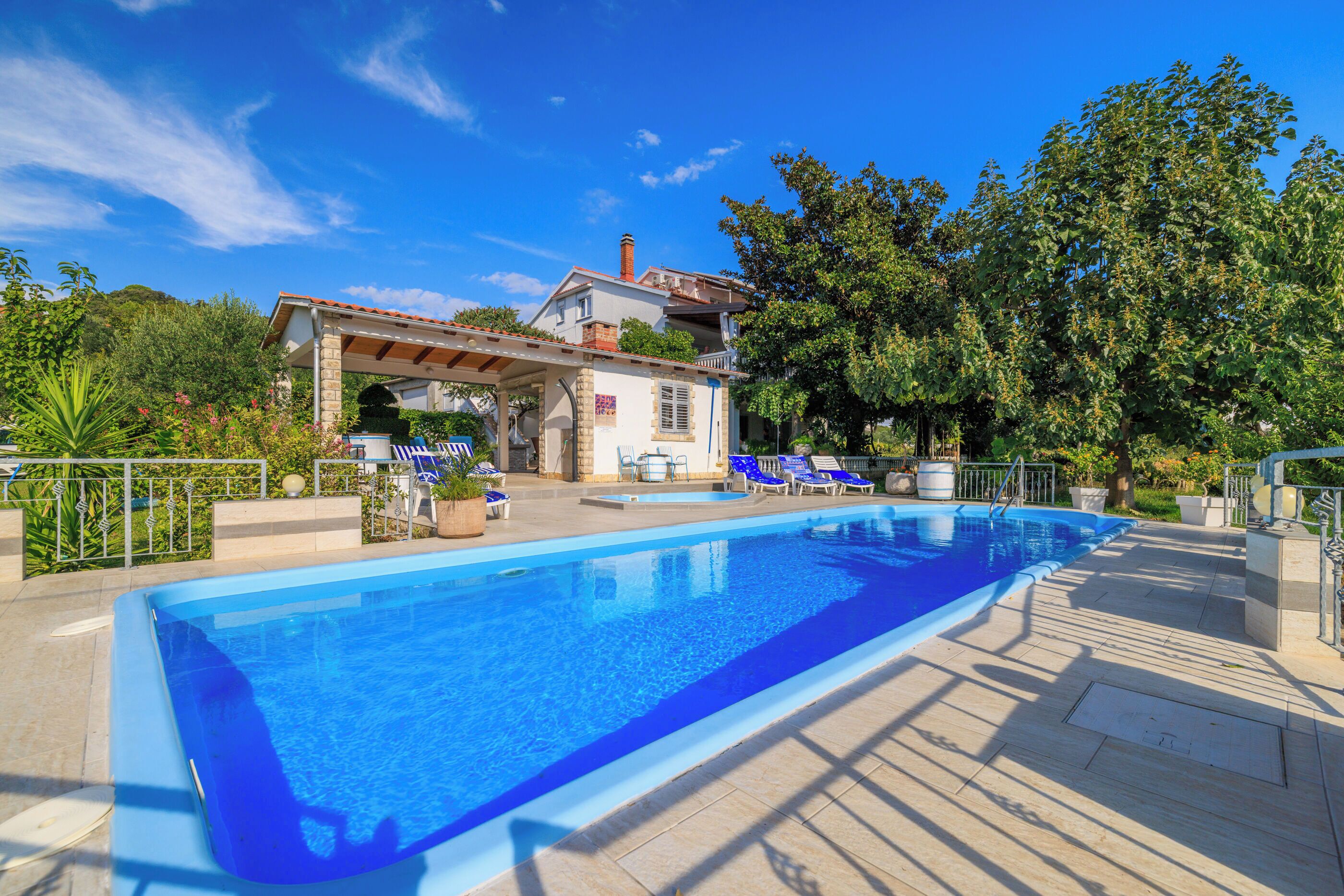 Outdoor pool, a heated pool, pool umbrellas