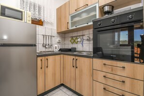 Apartment (A1) | Private kitchen | Fridge, oven, stovetop, espresso maker - Apartment Ivo (Marina)