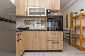 Apartamento (A1) | Cozinha privada | Geladeira, fogão, cooktop, máquina de café expresso