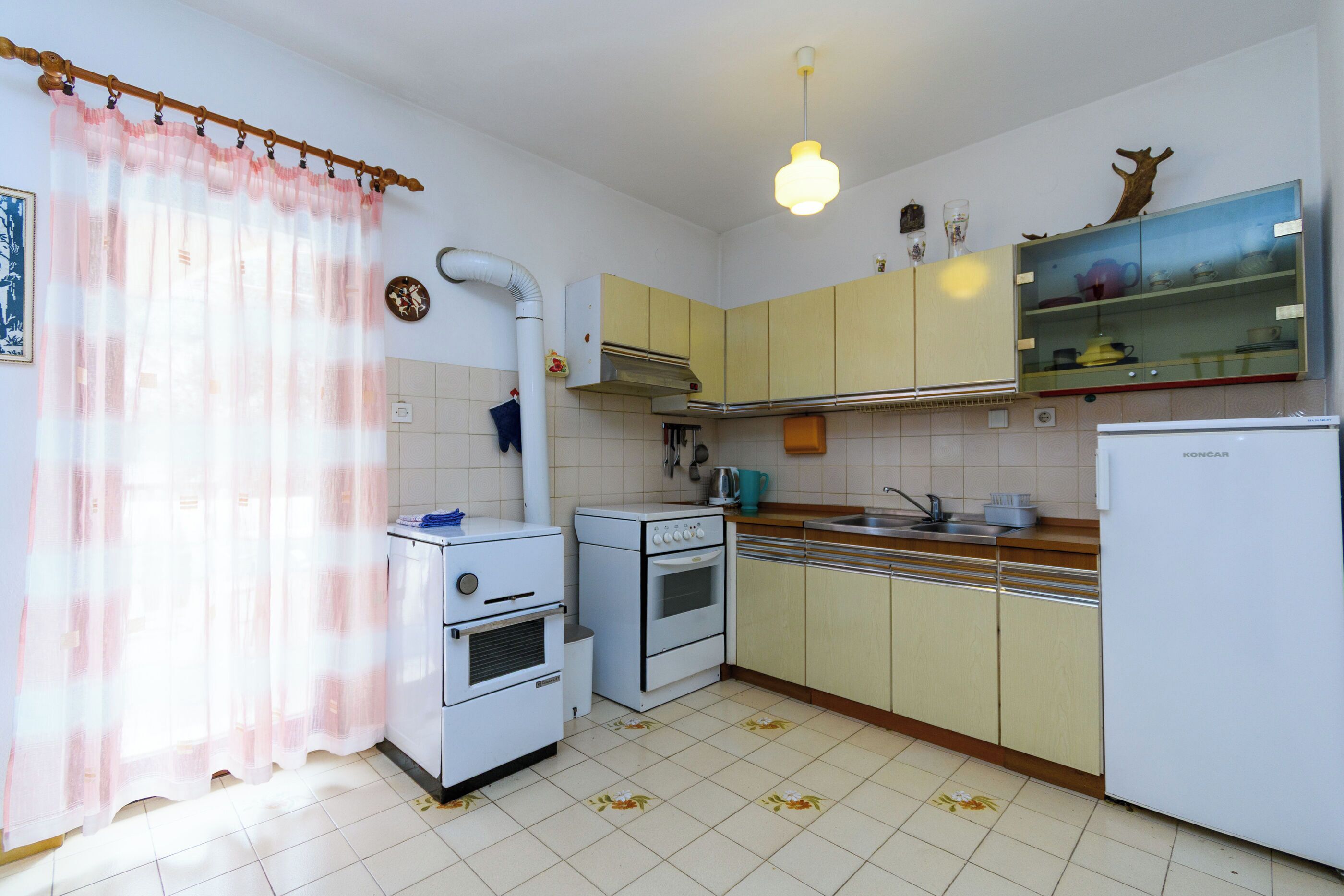 Appartamento (A1) | Cucina privata | Frigorifero, microonde, piano cottura, macchina per caffè espresso