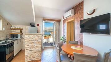 Apartment (A1) | Private kitchen | Fridge, microwave, oven, stovetop