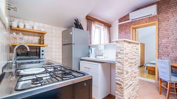 Apartment (A1) | Private kitchen | Fridge, microwave, oven, stovetop