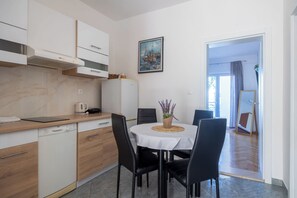 Apartment (A2) | Private kitchen | Fridge, stovetop, cookware/dishes/utensils - Apartments Josip (Baska Voda)