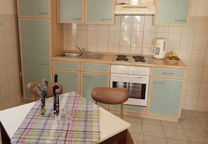 Apartment (A3) | Private kitchen | Fridge, stovetop, electric kettle, cookware/dishes/utensils - Apartments Ivan Z (Starigrad)