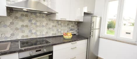Apartment (A1) | Private kitchen | Fridge, microwave, oven, stovetop