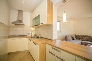 Apartment (A3) | Private kitchen | Fridge, microwave, stovetop, dishwasher - Apartments Saga 2 (Omis)