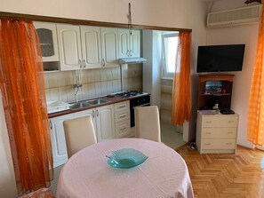 Apartment (A2) | Private kitchen | Fridge, microwave, oven, stovetop