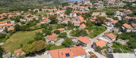 A residential area with houses, a swimming pool, and a church.