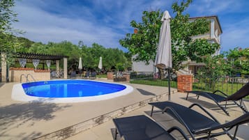 Outdoor pool, pool umbrellas, pool loungers