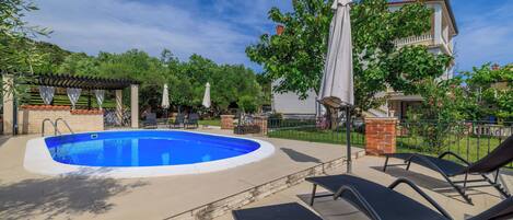 Outdoor pool, pool umbrellas, sun loungers