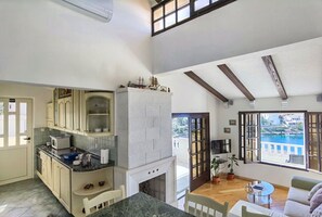 Apartment (A1) | Private kitchen | Fridge, microwave, oven, stovetop