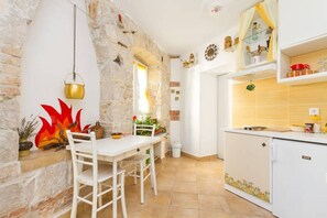 Apartment (A1) | Private kitchen | Fridge, stovetop, electric kettle, cookware/dishes/utensils - Apartment Happy (Split)