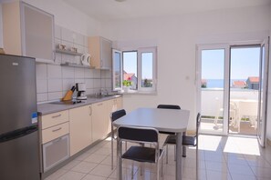Apartment (A5) | Private kitchen | Fridge, stovetop, electric kettle, cookware/dishes/utensils