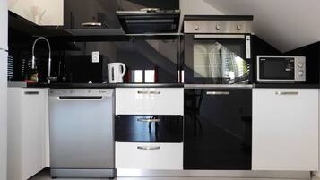 Apartamento (A4) | Cozinha privada | Cooktop, talheres/pratos/utensílios de cozinha