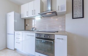 Apartamento (A2) | Cozinha privada | Geladeira, micro-ondas, fogão, cooktop