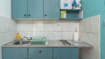 Appartement (A1) | Cuisine privée | Réfrigérateur, plaque de cuisson, machine à expresso