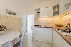 Apartment (A1) | Private kitchen | Fridge, microwave, stovetop, electric kettle - Apartments Anki (Podgora)